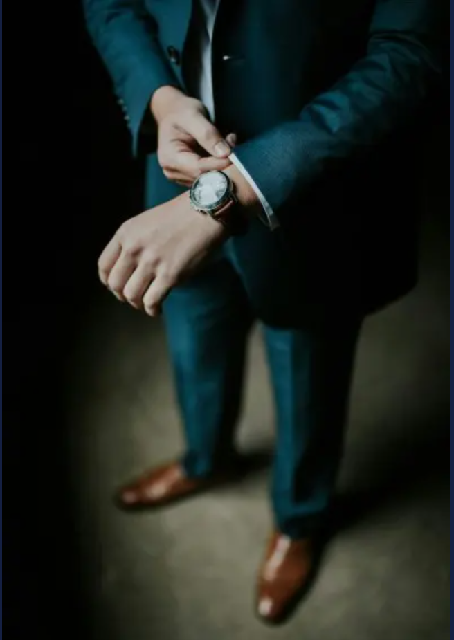 Businessman Adjusting Watch